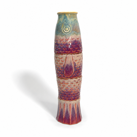 Four ceramic cups stacked to form a koi fish